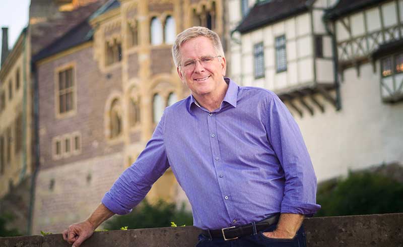 Public television personality Rick Steves in front of the Wartburg Castle in Germany.