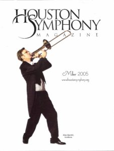 Man playing trombone on magazine cover.