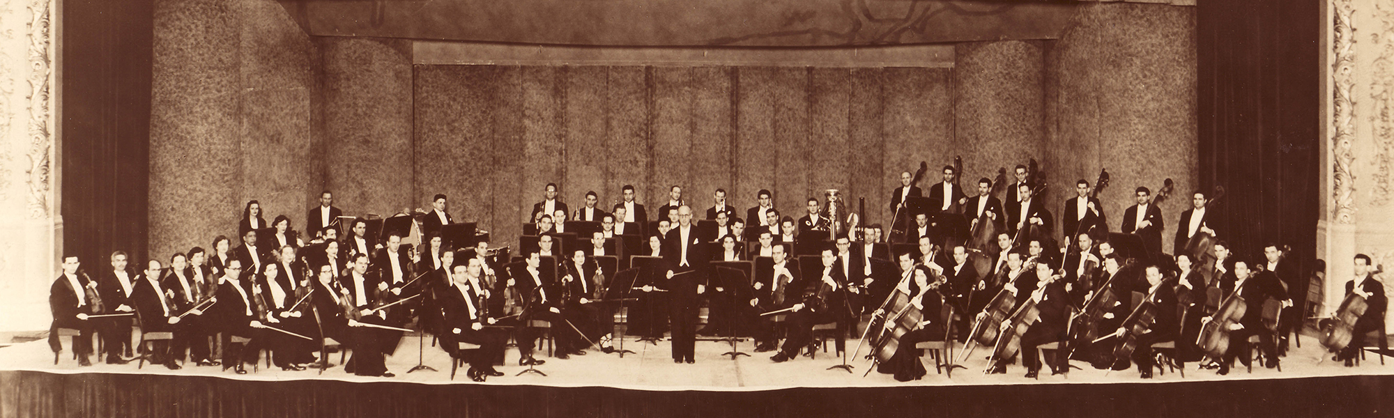 The Symphony on stage at the Houston City Auditorium in the 1940s</b></em></small>