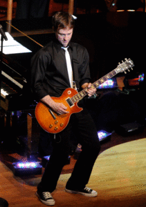 Michael Cavanaugh playing electric guitar