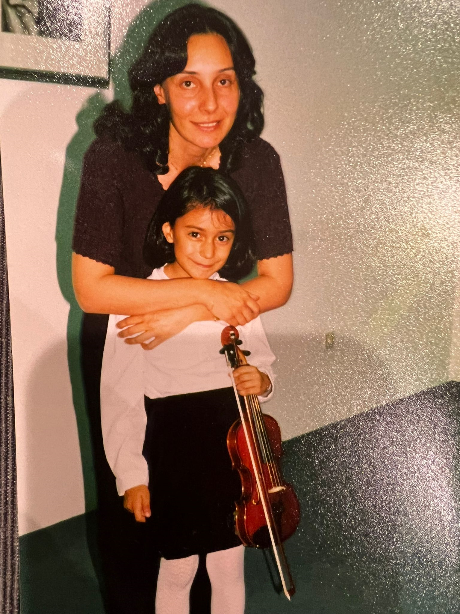 Yankı with her first violin teacher at age 8.